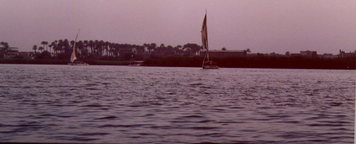 Small sailing boats called feluccas carry passengers on the Nile in the evenings as the heat from the day disappears and the light turns from the bright, hot white to the orange reds of sunset and then the pinks and purples of dusk.